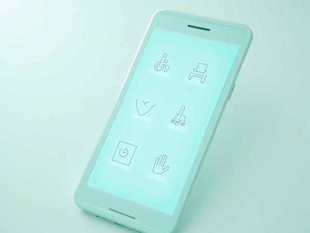 Symbole für Barrierefreiheit auf einem Smartphone-Bildschirm
